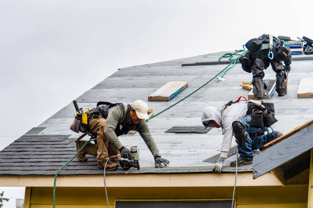 Professional Gutter Installation technician working in Electric City, WA